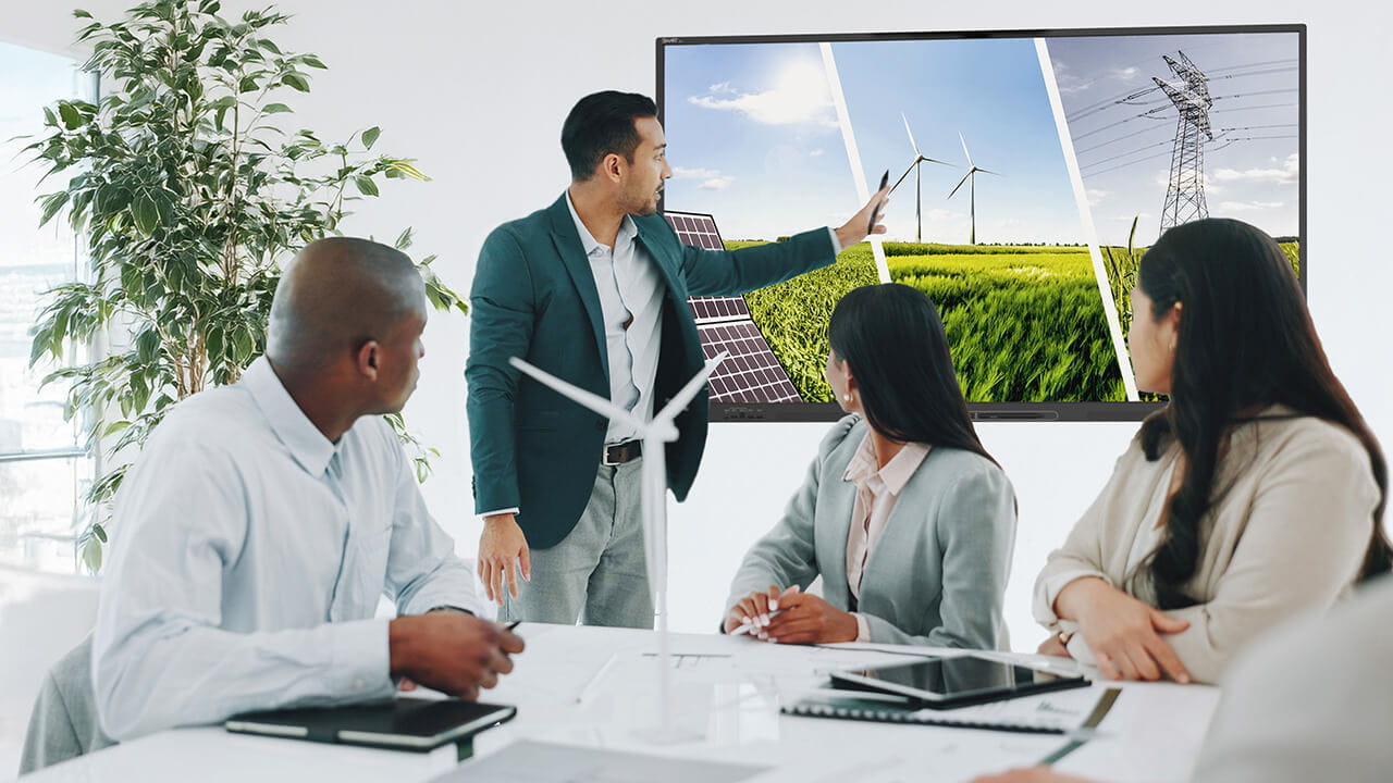 Business meeting using a SMART Board talking about sustainability
