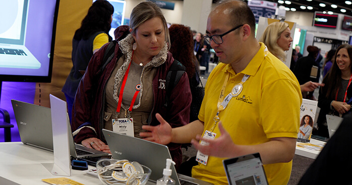 Image of a Lumio employee showcasing software.